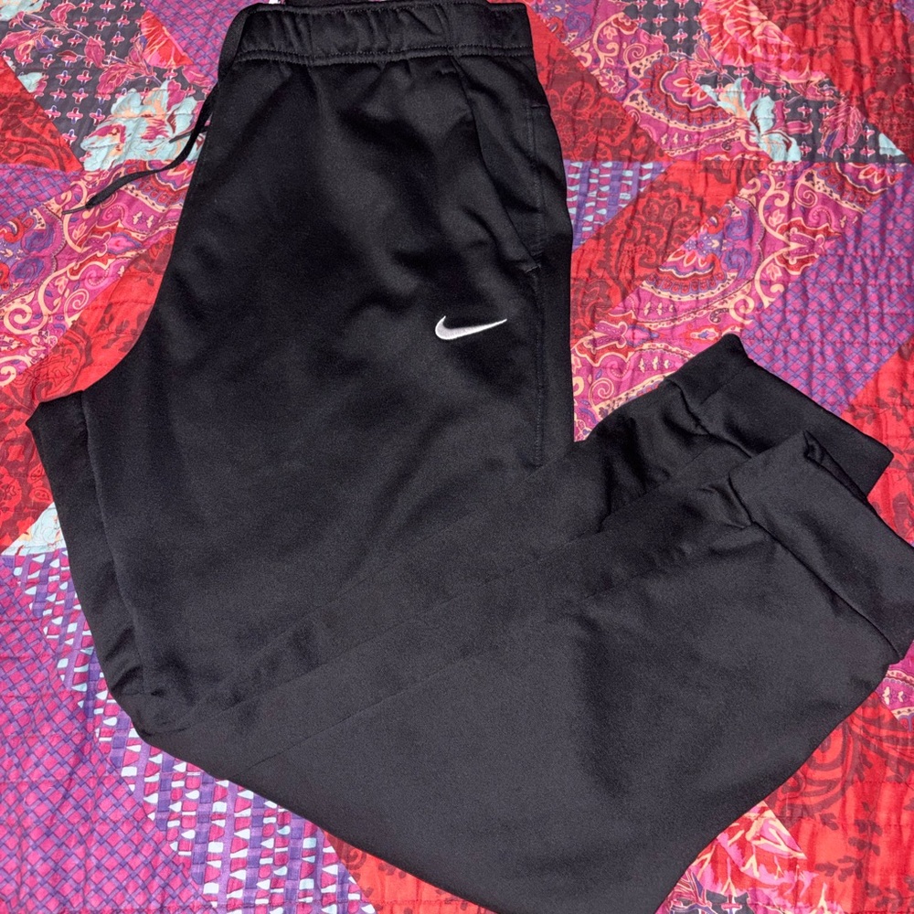 Nike Therma-FIT joggers or track pants.